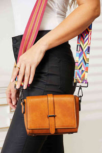 Chic and functional wide strap crossbody bag with colorful strap, perfect for organizing essentials.