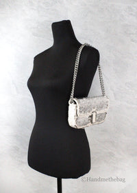 Marc Jacobs Mini J Marc Shoulder Cream Sequined Bag displayed on a mannequin, showcasing the mini sequined shoulder bag design.