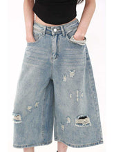 Cropped jeans paired with white sneakers