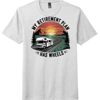 RV retirement shirt District DM130 featuring graphic of RV on road with sunset and text 'My Retirement Plan has Wheels'.