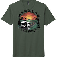 RV retirement shirt District DM130 featuring a graphic of an RV on a road with mountains and sunset on heathered forest green tee.