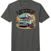 District Perfect Tri Tee featuring humorous graphic saying 'Sorry for What I Said While Backing Up' on charcoal shirt.