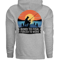 Born to Fish Hoodie featuring a fisherman on a sunset pier with the text 'BORD TO FISH, FORCED TO WORK'.