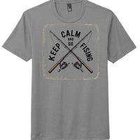 Keep Calm and Go Fishing graphic on a grey perfect tri t-shirt featuring fishing rods and reels.