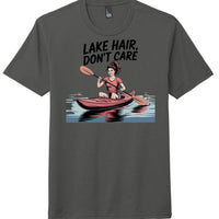 lake hair t-shirt featuring a woman kayaking with the phrase 'Lake Hair, Don't Care' on a charcoal tee.