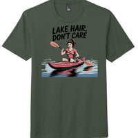 lake hair t-shirt featuring a woman kayaking in a green tee with the text 'LAKE HAIR, DON'T CARE'