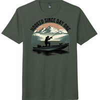 Hooked Since Day One graphic on Heathered Forest Green perfect tri blend tee for fishing enthusiasts.