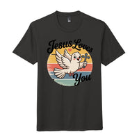 Jesus loves you t-shirt featuring a dove and cross design on a dark background.